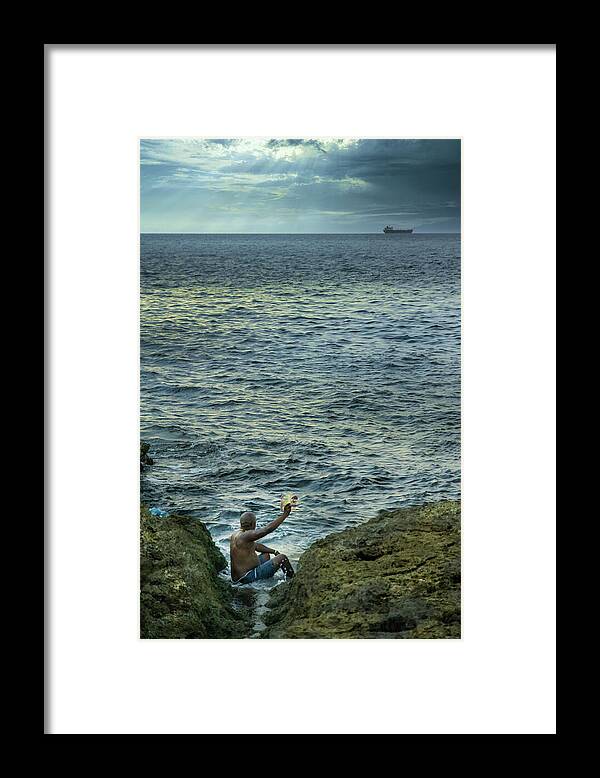 Storyteller Framed Print featuring the photograph The man who tells stories to the fishes by Micah Offman