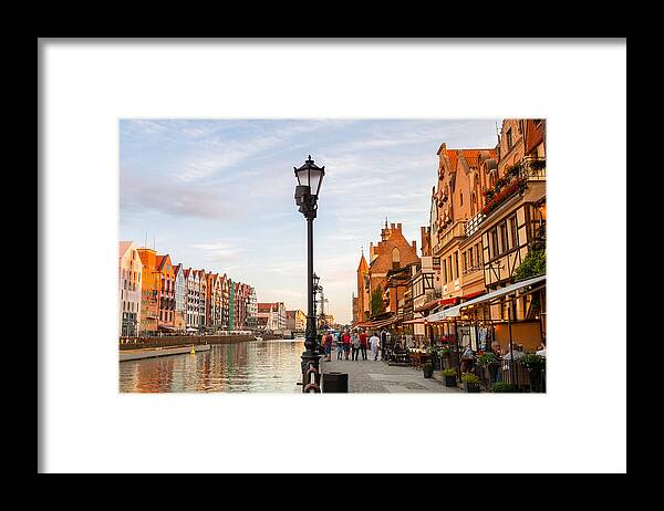 Water's Edge Framed Print featuring the photograph The waterfront area of Gdansk by Syolacan