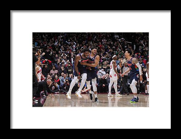 Joel Embiid Framed Print featuring the photograph Tobias Harris and Joel Embiid by Mark Blinch