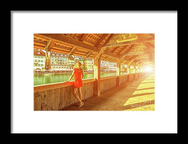Lucerne Framed Print featuring the photograph Tourist on Lucerne bridge by Benny Marty
