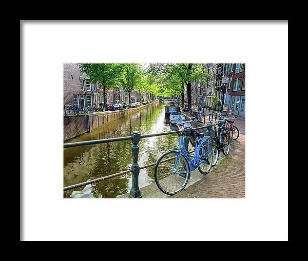 Tradition Framed Print featuring the photograph Typical canal and bikes in Amsterdam, Netherlands by Elenarts - Elena Duvernay photo