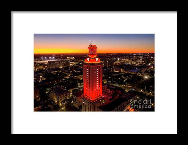 Texas Texas Framed Print featuring the photograph University of Texas Tower lit with Number 1 bright Orange Tower by Dan Herron