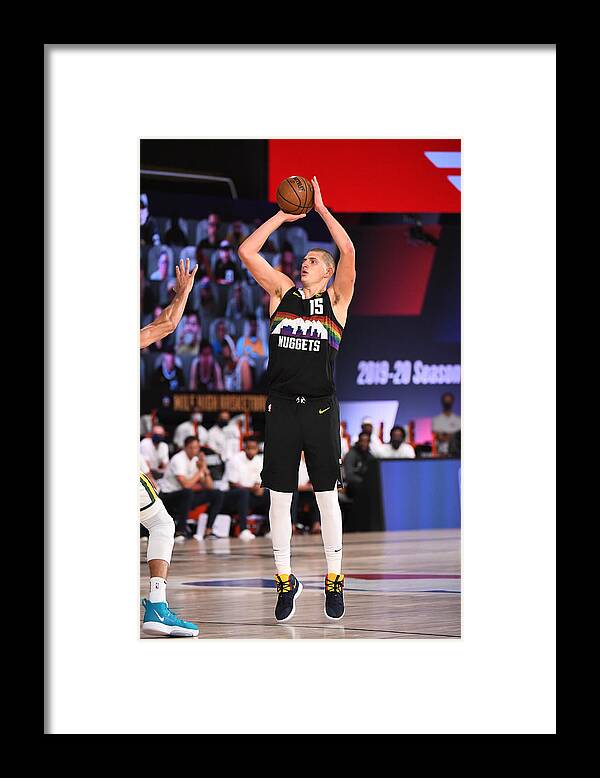 Nikola Jokic Framed Print featuring the photograph Utah Jazz v Denver Nuggets - Game One by Garrett Ellwood