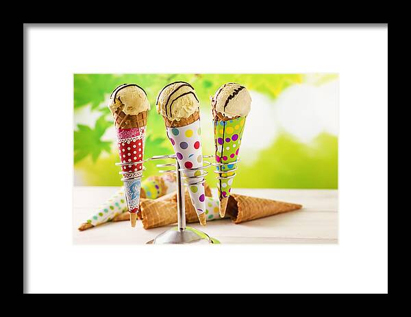 Chocolate Sauce Framed Print featuring the photograph Vanilla ice cream cones with chocolate sauce by GMVozd
