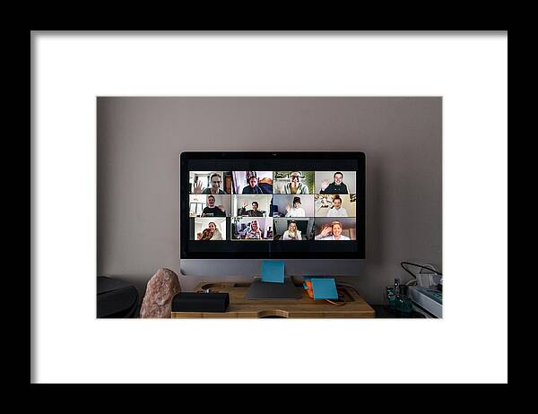 Working Framed Print featuring the photograph Video Conference by SolStock