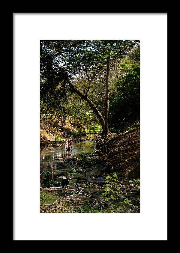 Wading Framed Print featuring the photograph Wading the Jatibonico river by Micah Offman