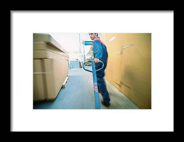 Working Framed Print featuring the photograph Warehouse worker by James Hardy