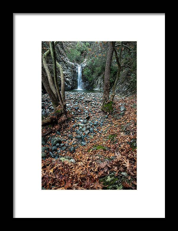 Autumn Landscape Framed Print featuring the photograph Waterfall splashing in the canyon in autumn. by Michalakis Ppalis