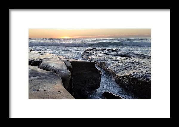 Tranquility Framed Print featuring the photograph Waves on rocks at sunset by Shabnam Mozafari / FOAP