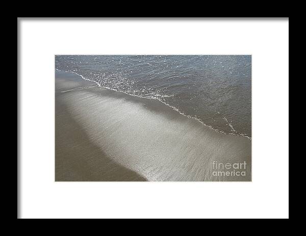 Sandy Beach Framed Print featuring the photograph Wet sand, sea water and reflections of sunlight 2 by Adriana Mueller
