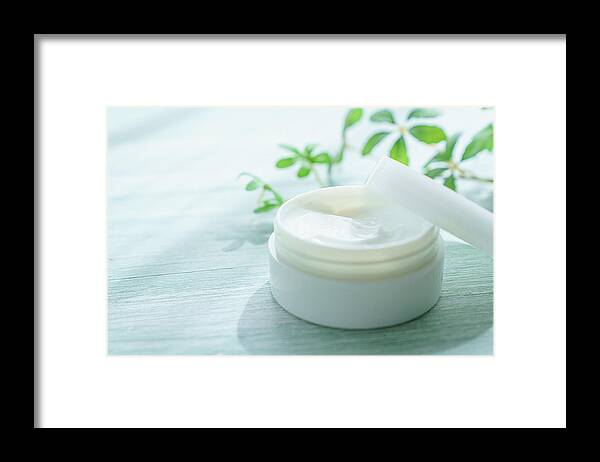 Skin Framed Print featuring the photograph White Beauty Cream On Wooden Background by Wako Megumi