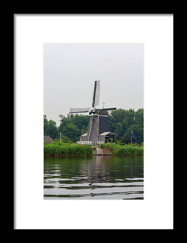 North Holland Framed Print featuring the photograph Windmill De Eenhoorn in Haarlem, the Netherlands by Flottmynd