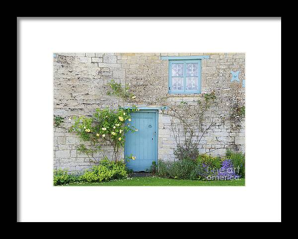 Windrush Framed Print featuring the photograph Windrush village Cottage Door and Roses by Tim Gainey