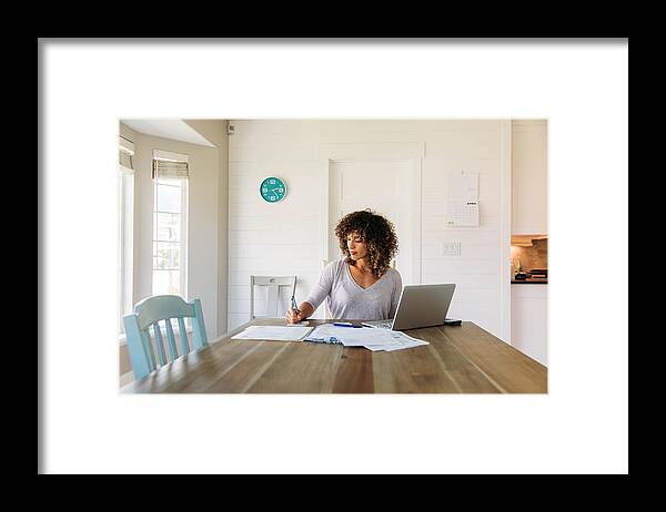 Financial Figures Framed Print featuring the photograph Woman Doing Finances at Home by RichVintage
