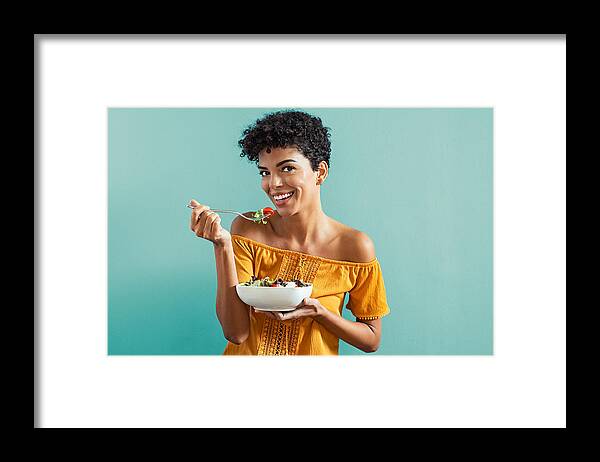 People Framed Print featuring the photograph Woman eating salad by Ridofranz