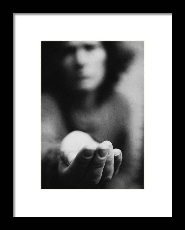 Debt Framed Print featuring the photograph Woman holding hand out, blurred, b&w by Laurent Hamels