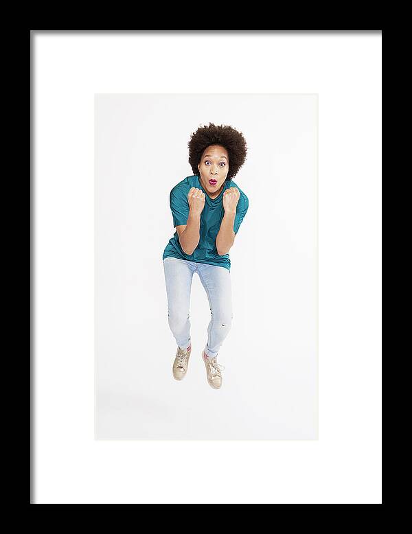 Fist Framed Print featuring the photograph Woman Jumping In Celebration by Tara Moore