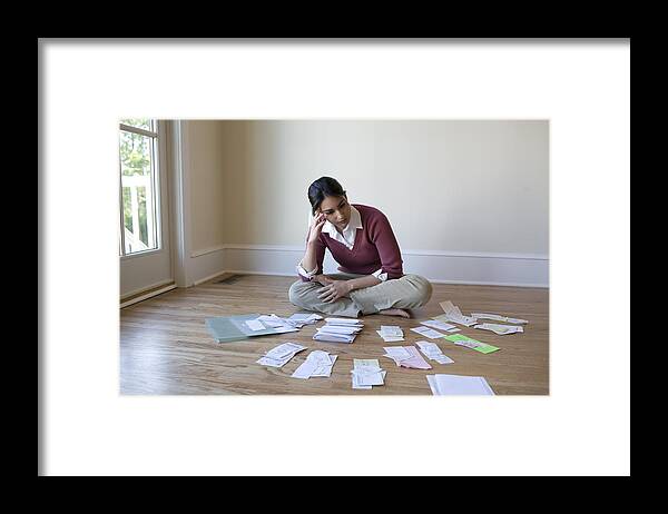 Debt Framed Print featuring the photograph Woman looking at bills and receipts on floor by David Sacks