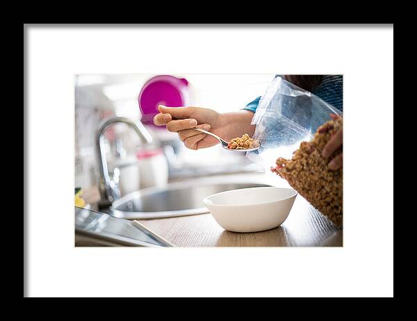 People Framed Print featuring the photograph Woman prepares granules for breakfast by Milan Markovic