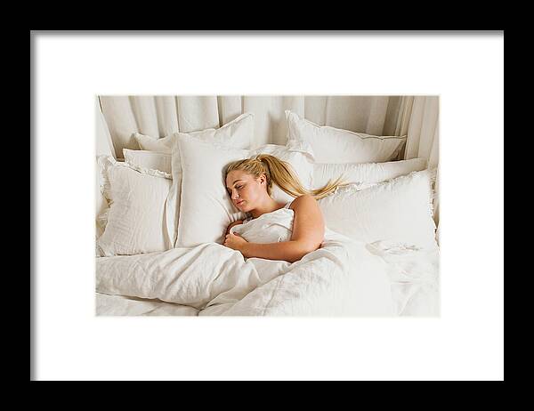 People Framed Print featuring the photograph Woman sleeping in bed by Image Source