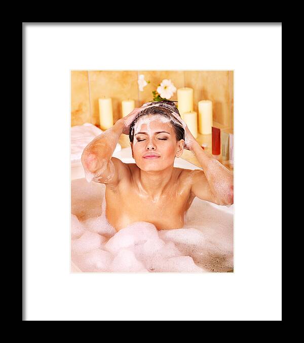 Tiled Floor Framed Print featuring the photograph Woman washing hair by shampoo by Targovcom