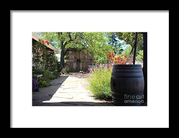 Wooden Barrel Framed Print featuring the photograph Wooden Barrel In Garden Solvang CA by Colleen Cornelius