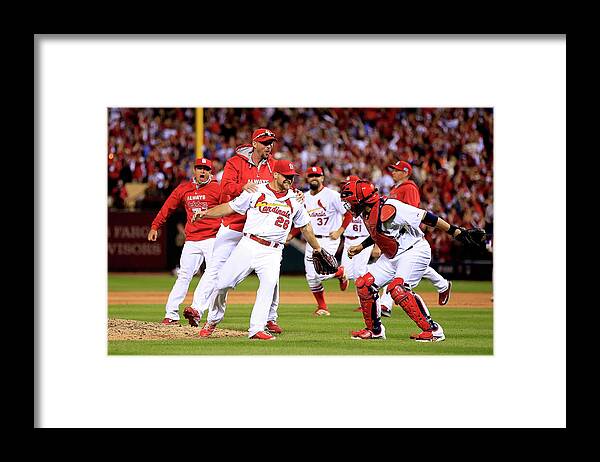 St. Louis Cardinals Framed Print featuring the photograph Yadier Molina and Trevor Rosenthal by Jamie Squire