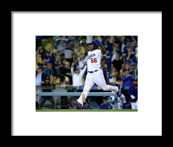 Ninth Inning Framed Print featuring the photograph Yasiel Puig and Howie Kendrick by Stephen Dunn