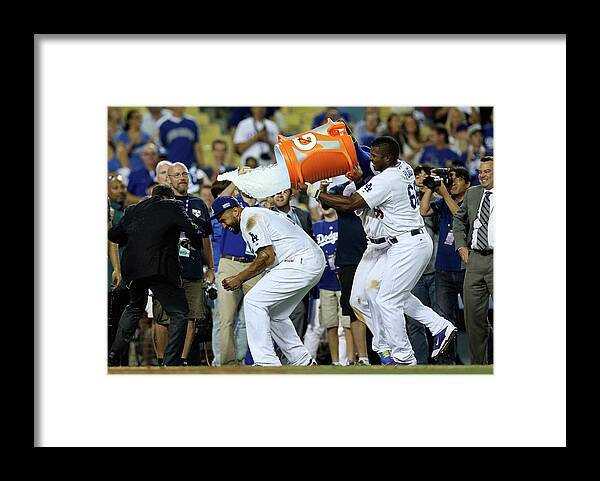 Game Two Framed Print featuring the photograph Yasiel Puig and Matt Kemp by Stephen Dunn