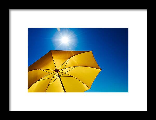 Shadow Framed Print featuring the photograph Yellow Umbrella With Bright Sun And Blue Sky by Grafxart8888