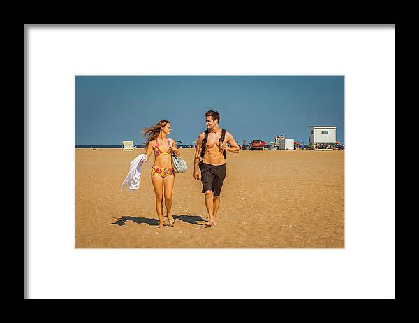Young Framed Print featuring the photograph Young American Couple traveling, relaxing on the beach in New Je by Alexander Image