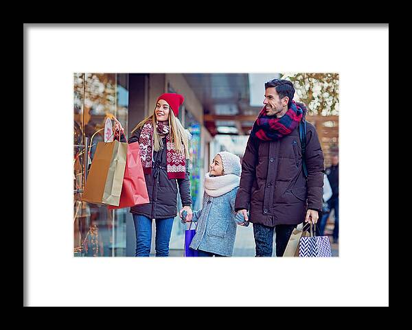 Bulgaria Framed Print featuring the photograph Young couple is shopping at Christmas by Praetorianphoto