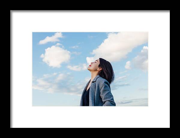 Tranquility Framed Print featuring the photograph Young Lady Embracing Hope And Freedom by Oscar Wong