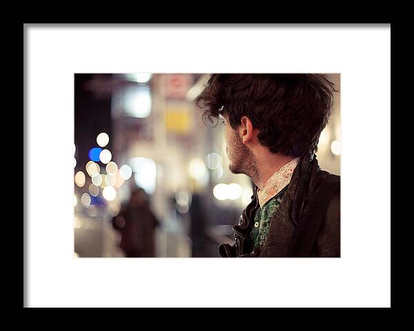 Outdoors Framed Print featuring the photograph Young man looks down road at night by James Whitaker