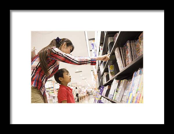 4-5 Years Framed Print featuring the photograph Young Mother And Child In Bookstore by Michael H