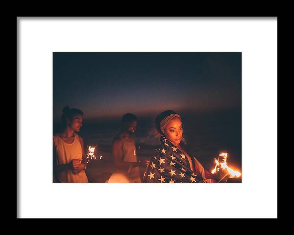 Young Men Framed Print featuring the photograph Young multi-ethnic hipster friends celebrating fourth of July with sparklers by Wundervisuals