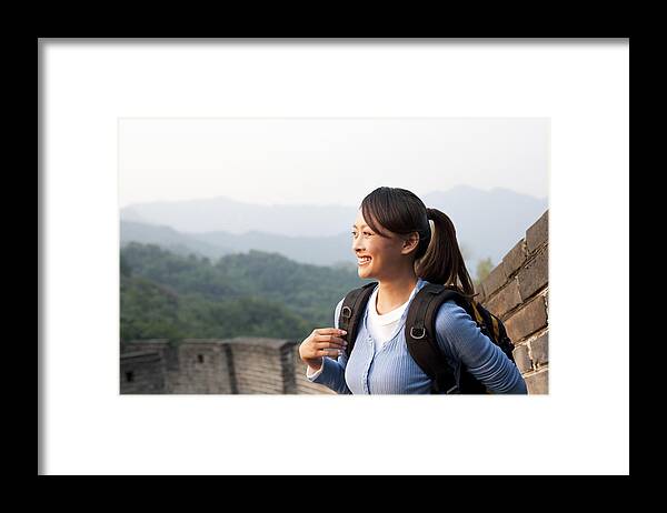 Young Men Framed Print featuring the photograph Young people go hiking on the Great Wall by Lane Oatey/Blue Jean Images
