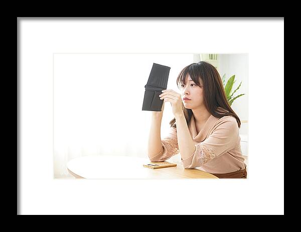 Debt Framed Print featuring the photograph Young woman figuring domestic accounts by Maroke