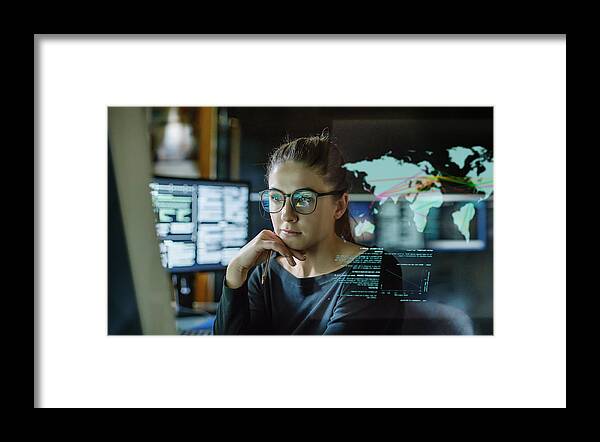 Expertise Framed Print featuring the photograph Young woman global communications by Laurence Dutton