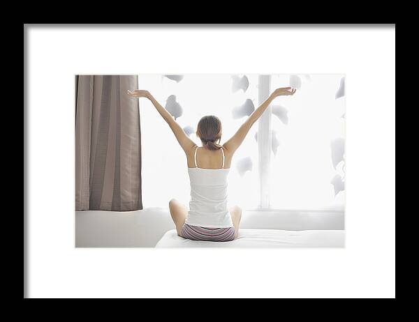 Human Arm Framed Print featuring the photograph Young woman is stretching your back by Yagi Studio