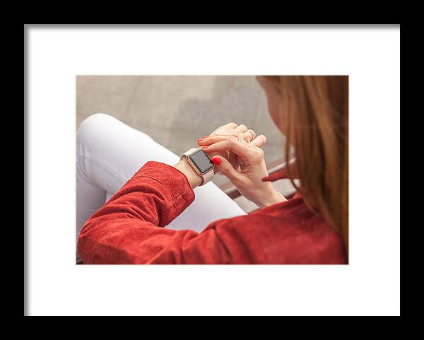 Internet Framed Print featuring the photograph Young Woman Use Smart Watch With Blank Screen Outdoor by S_Chum