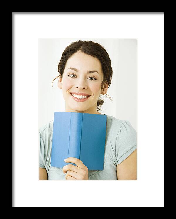People Framed Print featuring the photograph Young woman with book, smiling by Pando Hall