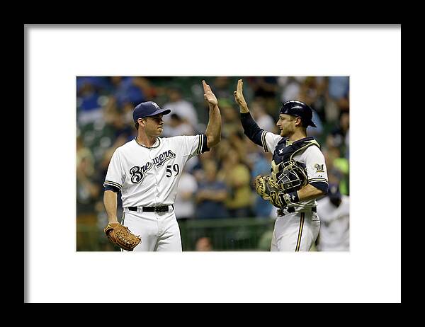 American League Baseball Framed Print featuring the photograph Zach Duke and Jonathan Lucroy by Mike Mcginnis