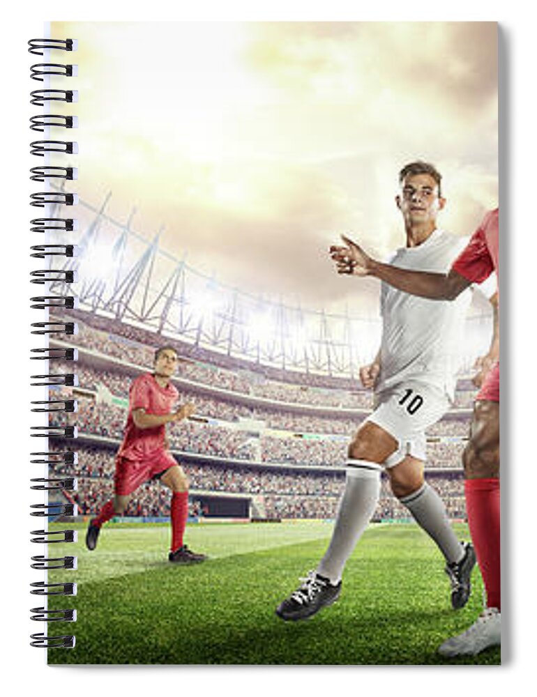 Soccer Uniform Spiral Notebook featuring the photograph Soccer Player Kicking Ball In Stadium by Dmytro Aksonov