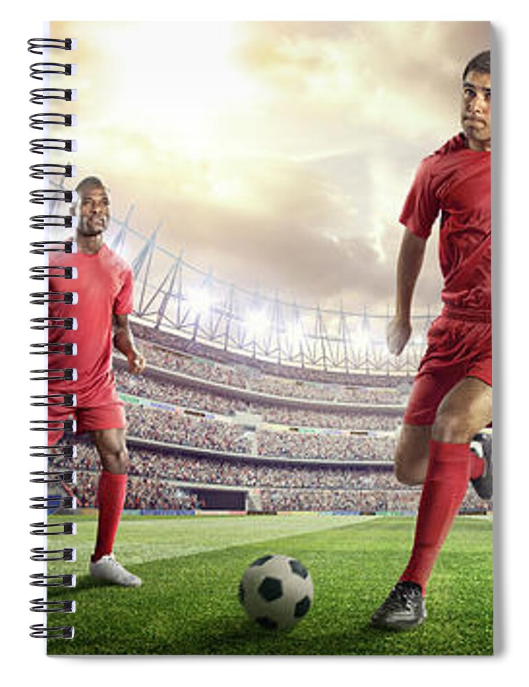 Soccer Uniform Spiral Notebook featuring the photograph Soccer Player Kicking Ball In Stadium #6 by Dmytro Aksonov