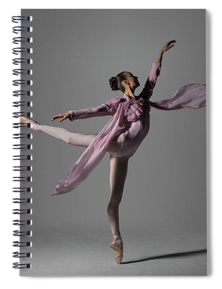 Ballet Dancer Spiral Notebook featuring the photograph Ballerina Performing Arabesque On Pointe by Nisian Hughes