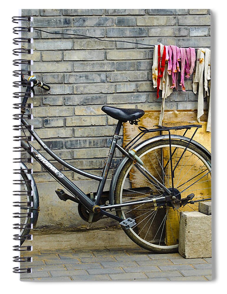 Bicycle Spiral Notebook featuring the photograph Bicycle In An Alleyway by John Shaw