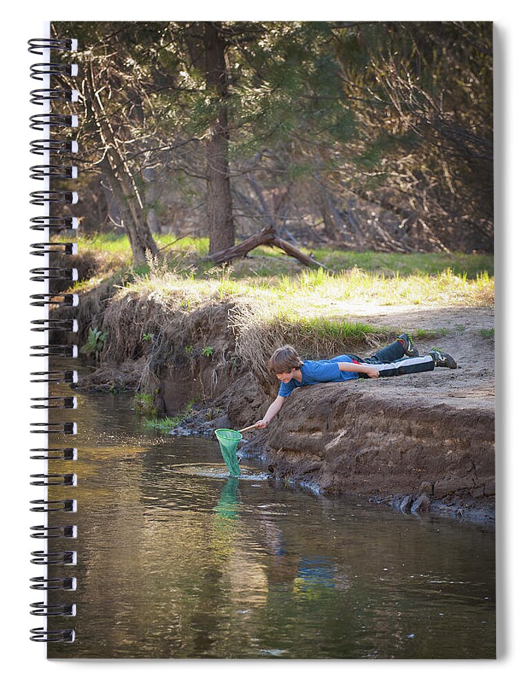 Child Spiral Notebook featuring the photograph Boy With Net Playing In A Stream by Stephen Simpson