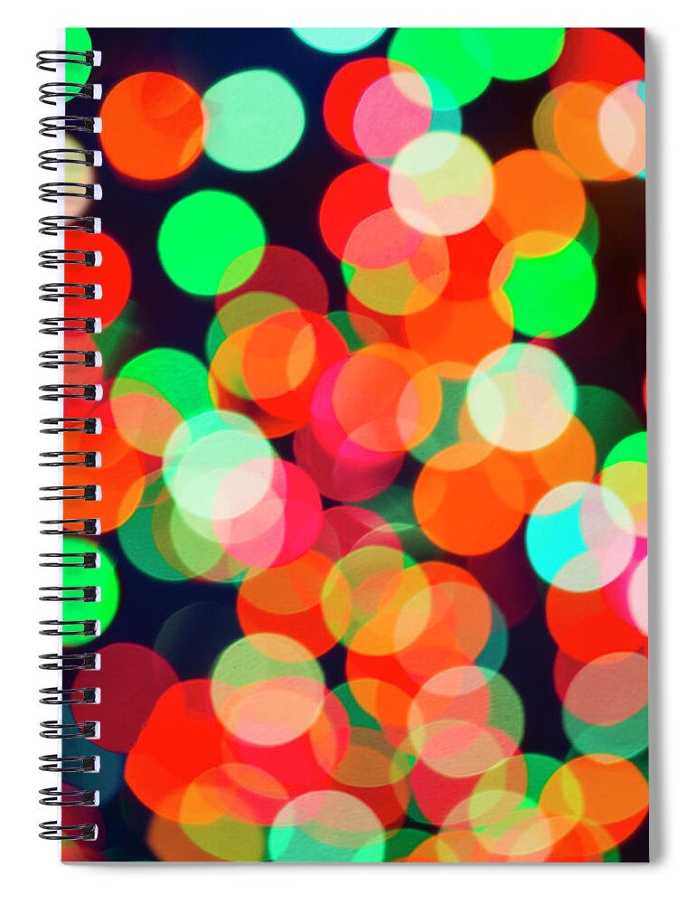 Holiday Spiral Notebook featuring the photograph Defocused Lights by Tetra Images