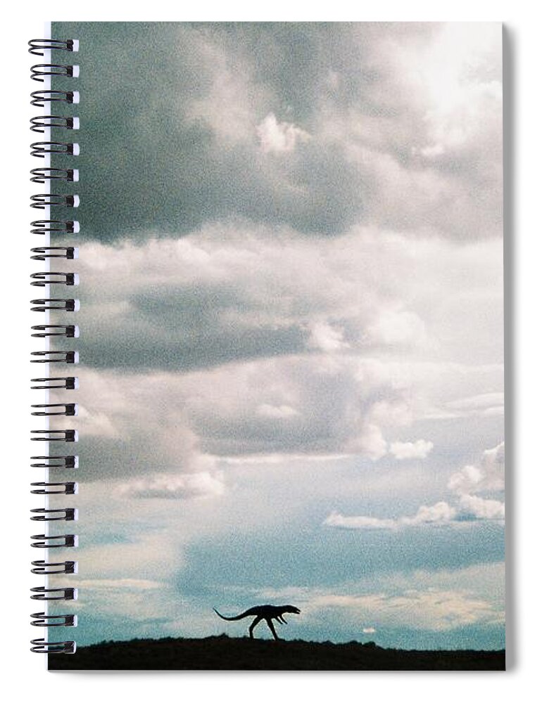 Headed West On Interstate 40 I Caught This Dinosaur In The Foreground Of Western Storm Clouds Of White Spiral Notebook featuring the photograph Dinosaur on the Western Horizon by Belinda Lee